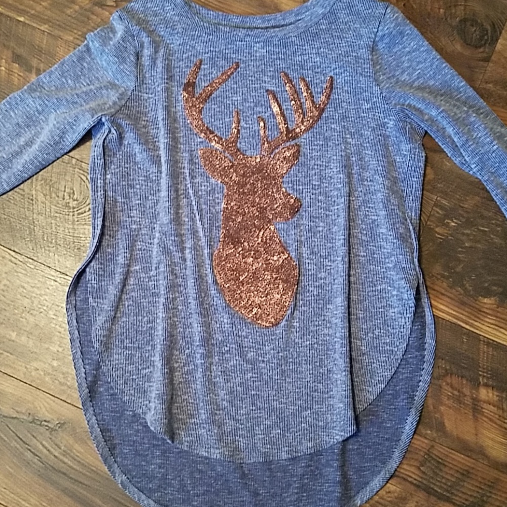 Glittery brown deer shirt.